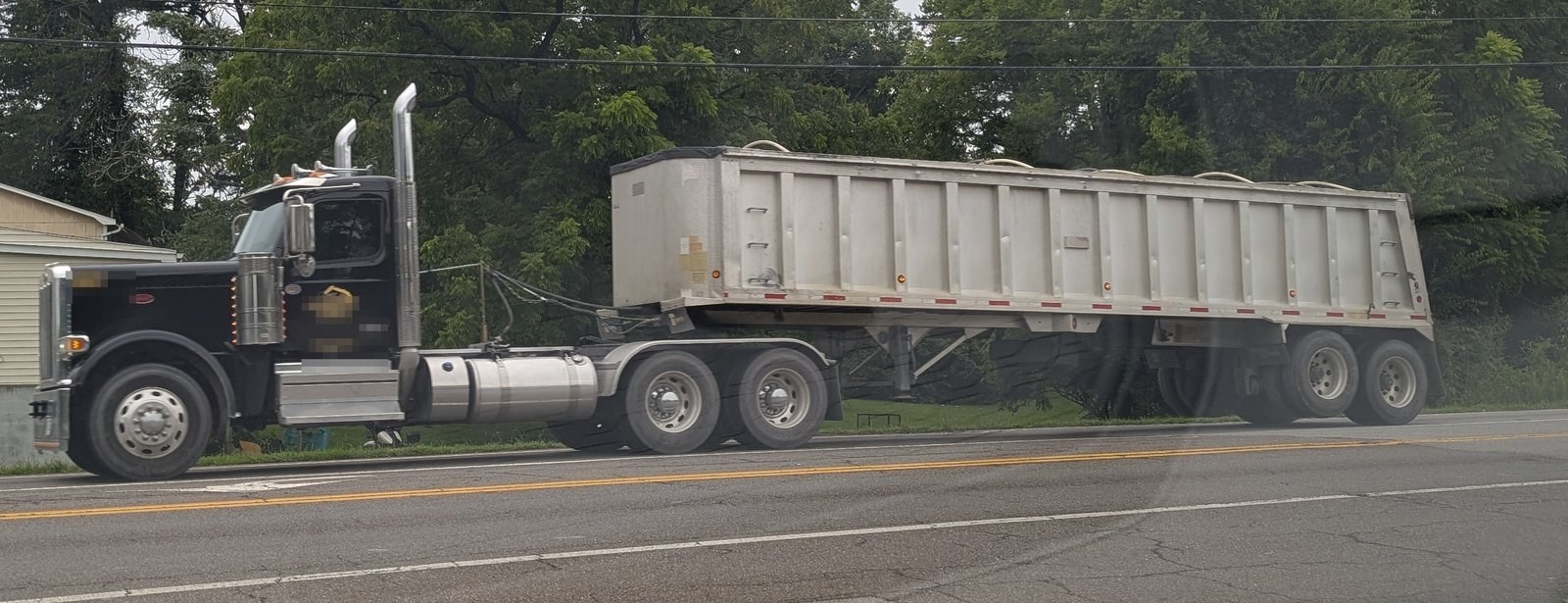 Tractor with aluminum end-dump trailer